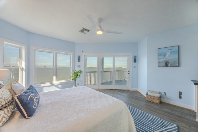 bedroom with access to exterior, dark hardwood / wood-style floors, and ceiling fan