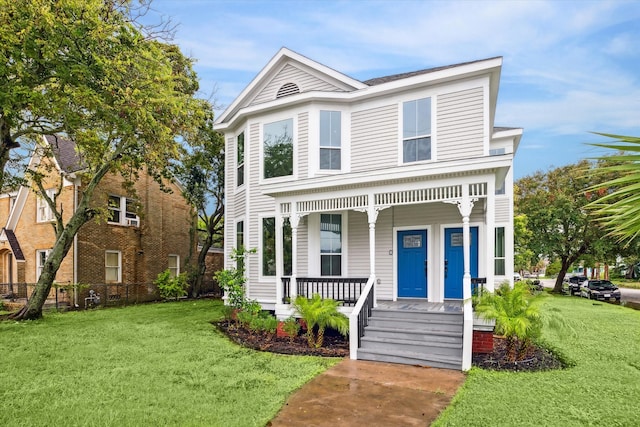 front of property with a porch and a front yard