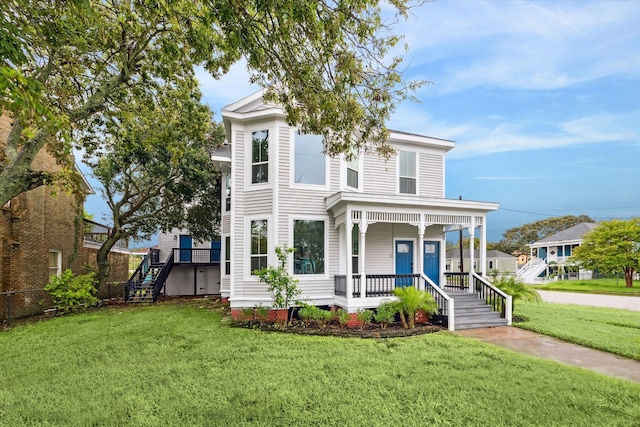 view of front facade with a porch and a front lawn