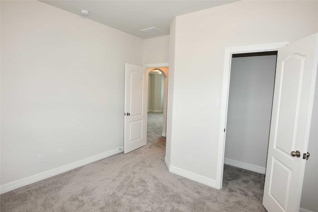 unfurnished bedroom featuring light colored carpet