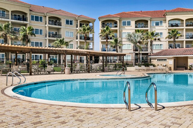 301 E Houston St Unit 3301, Port Isabel, TX 78578 - community pool featuring fence, a patio area, and a community hot tub
