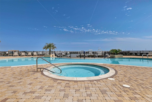 301 E Houston St Unit 3301, Port Isabel, TX 78578 - community pool with fence and a community hot tub