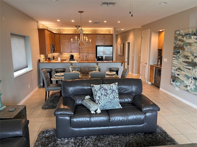 301 E Houston St Unit 3301, Port Isabel, TX 78578 - living area with light tile patterned floors, a chandelier, wine cooler, recessed lighting, and baseboards