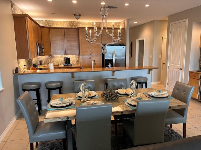 301 E Houston St Unit 3301, Port Isabel, TX 78578 - dining area featuring light tile patterned floors, a chandelier, baseboards, and recessed lighting
