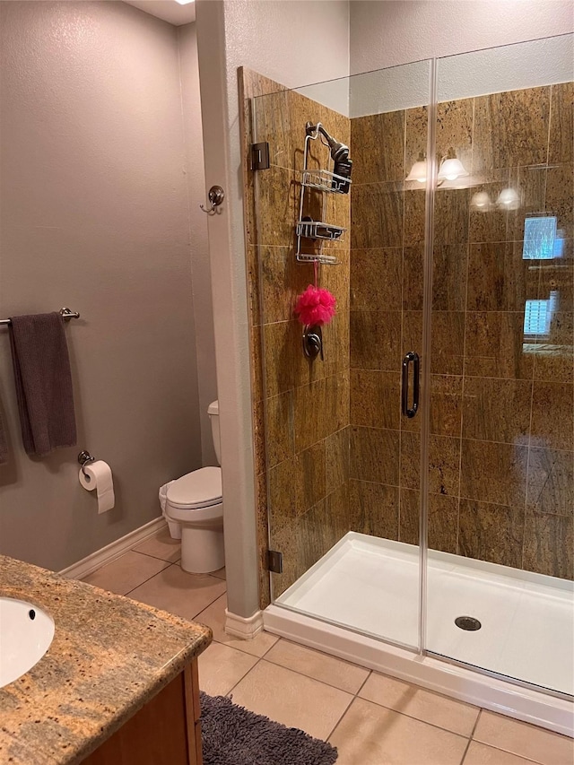 301 E Houston St Unit 3301, Port Isabel, TX 78578 - bathroom with tile patterned floors, a shower stall, toilet, and vanity