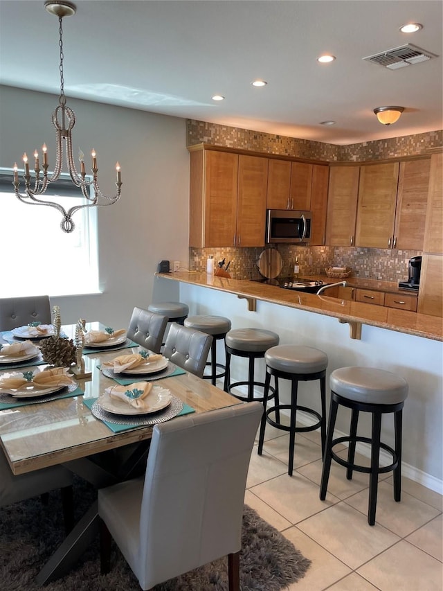 301 E Houston St Unit 3301, Port Isabel, TX 78578 - dining room with light tile patterned floors, a chandelier, and recessed lighting