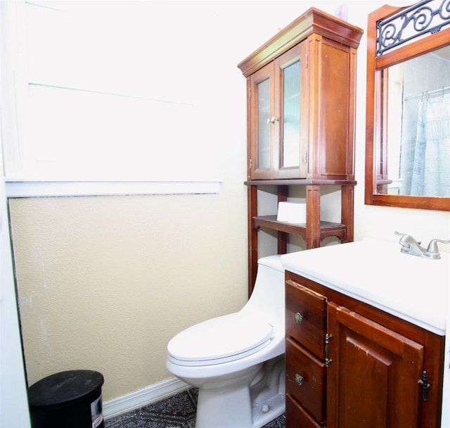 2202 Jones St, Rosenberg, TX 77471 - bathroom featuring toilet, vanity, and baseboards