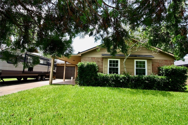 view of front of house with a garage and a front yard