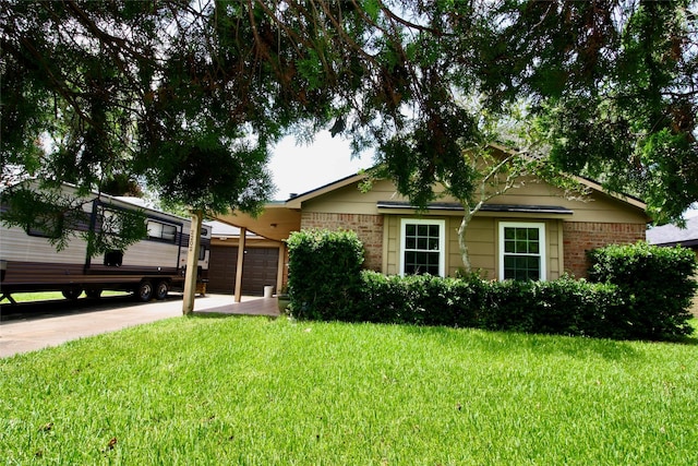 2202 Jones St, Rosenberg, TX 77471 - view of front facade with a garage, brick siding, and a front yard