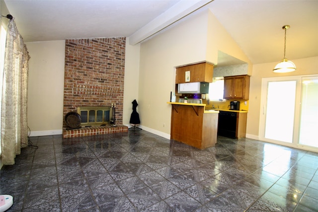 kitchen with brick wall, a fireplace, lofted ceiling, and dark tile patterned flooring