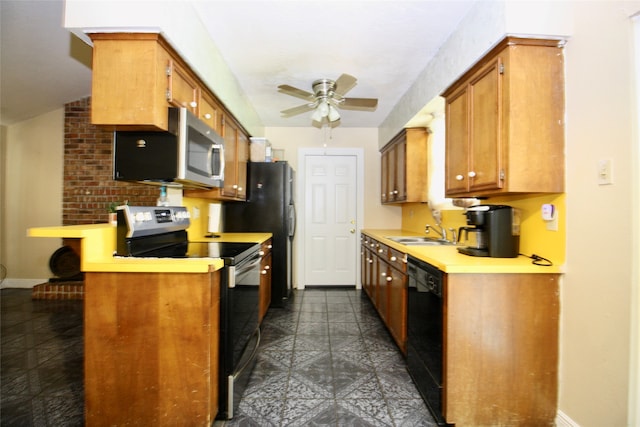 kitchen featuring ceiling fan, stainless steel appliances, sink, kitchen peninsula, and dark tile patterned flooring