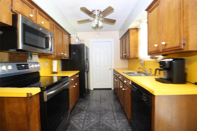 2202 Jones St, Rosenberg, TX 77471 - kitchen featuring black appliances, a sink, ceiling fan, light countertops, and brown cabinets
