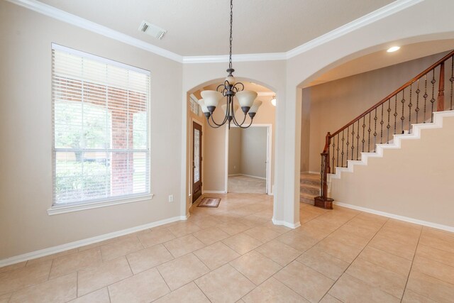 unfurnished dining area with crown molding, visible vents, baseboards, stairway, and an inviting chandelier