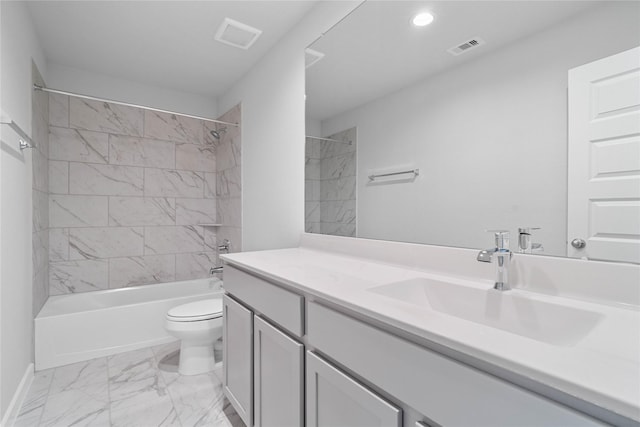 full bathroom featuring vanity, toilet, and tiled shower / bath