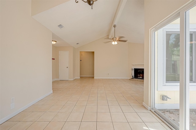 unfurnished living room featuring ceiling fan, light tile patterned flooring, a healthy amount of sunlight, and vaulted ceiling with beams