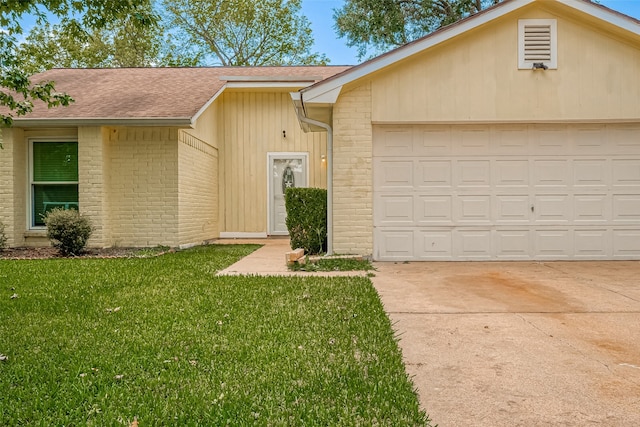 single story home with a front yard and a garage