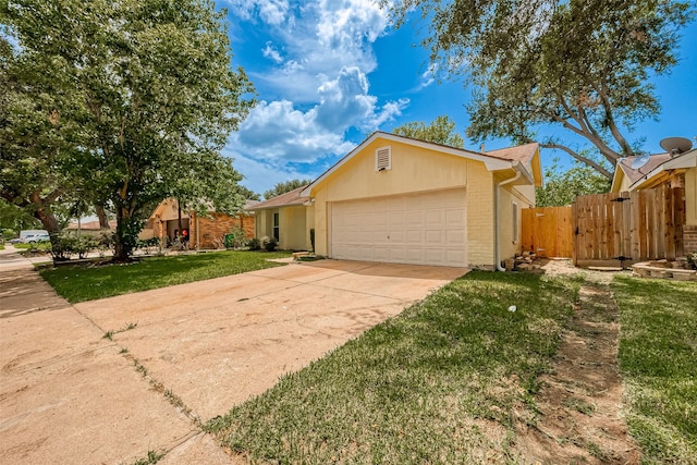 ranch-style house with a garage and a front yard