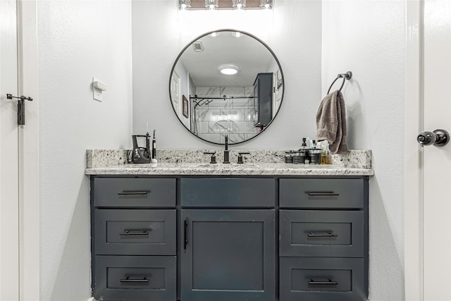 bathroom featuring vanity and a shower