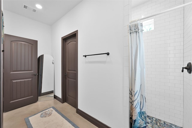 bathroom featuring walk in shower