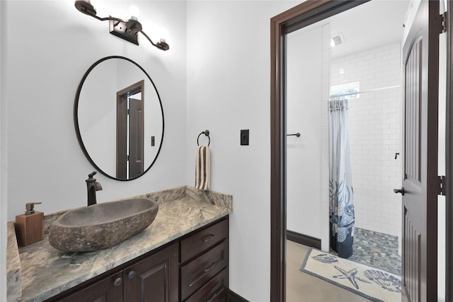 bathroom featuring vanity and walk in shower