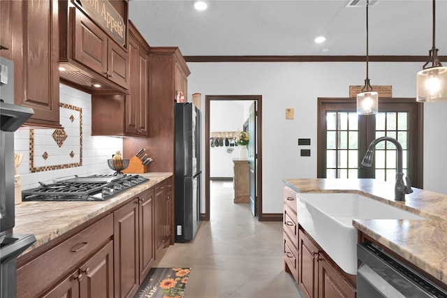 kitchen with stainless steel appliances, decorative backsplash, sink, hanging light fixtures, and ornamental molding