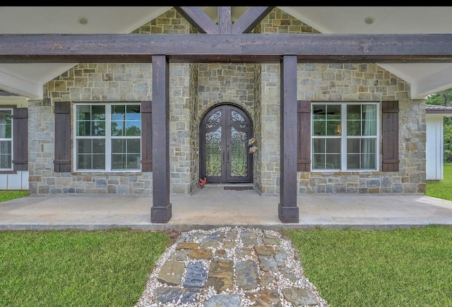 view of exterior entry featuring french doors