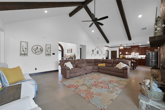 living room with ceiling fan, beamed ceiling, and high vaulted ceiling