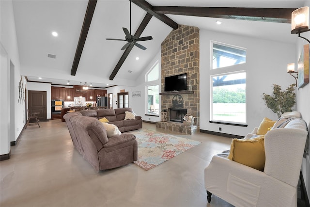 living room with high vaulted ceiling, plenty of natural light, beam ceiling, and ceiling fan