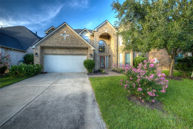 view of front property with a garage and a front yard