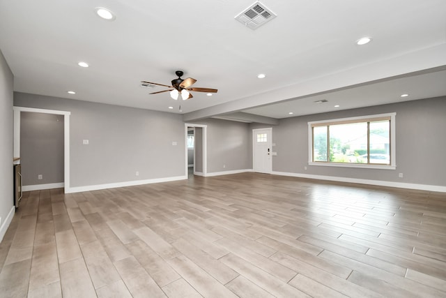 unfurnished room with ceiling fan and light wood-type flooring