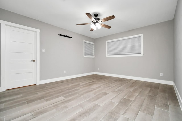 unfurnished room featuring ceiling fan and light hardwood / wood-style flooring