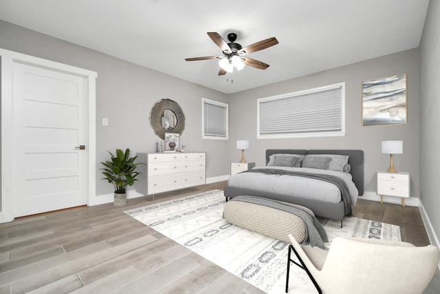 bedroom featuring ceiling fan and wood-type flooring