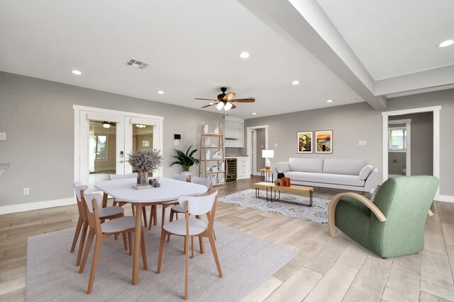 dining space featuring ceiling fan, french doors, and light wood-type flooring