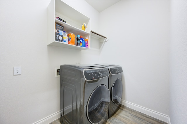 washroom featuring separate washer and dryer and hardwood / wood-style floors