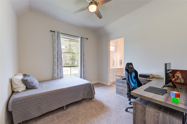 bedroom with ceiling fan, connected bathroom, vaulted ceiling, and light colored carpet