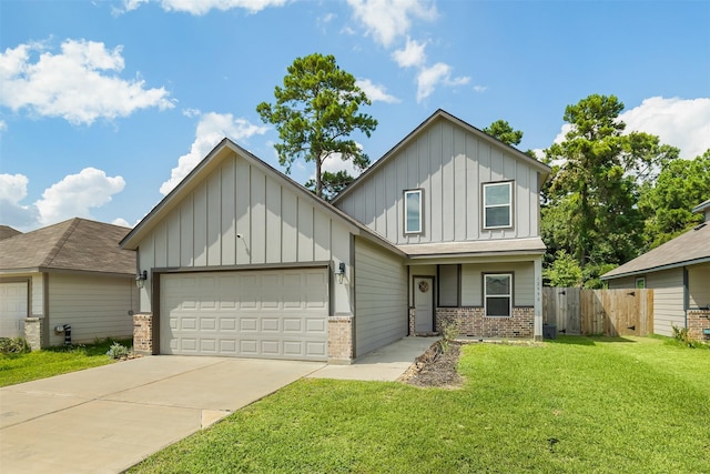 view of front of property with a front yard and a garage