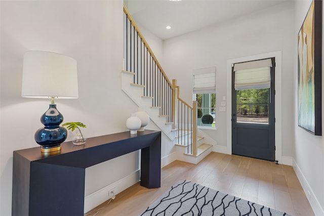 entryway with light hardwood / wood-style floors