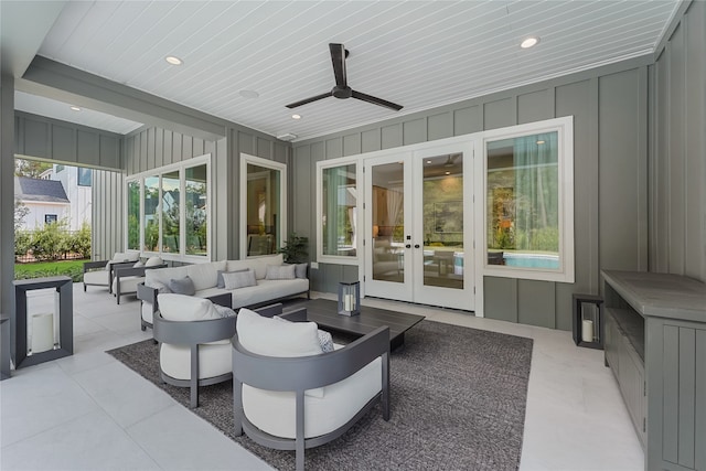 view of patio / terrace with french doors, an outdoor living space, and ceiling fan