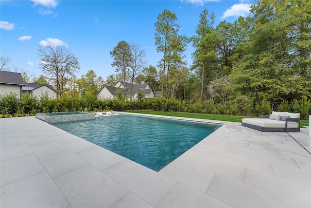 view of swimming pool featuring a patio area