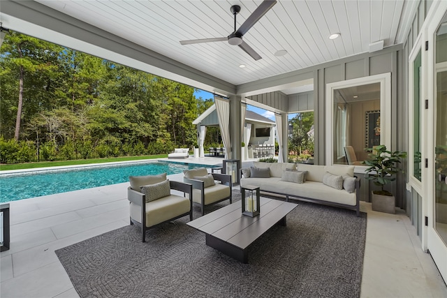 view of patio with outdoor lounge area and ceiling fan