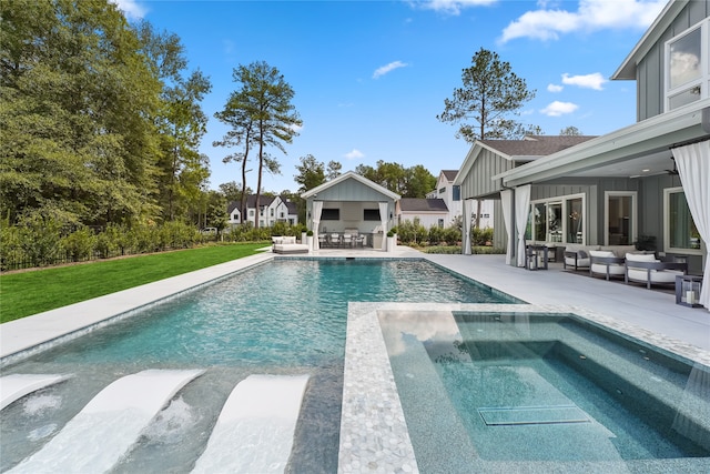 view of swimming pool with an outdoor kitchen, a patio area, and an outdoor hangout area