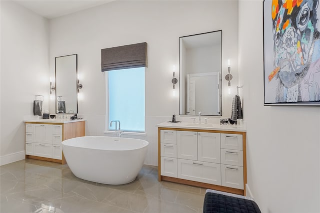 bathroom with double vanity, tile patterned floors, and a bath