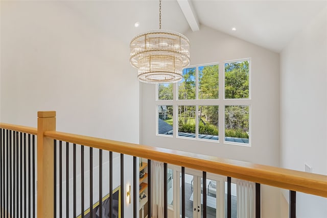 interior space featuring a notable chandelier and beam ceiling