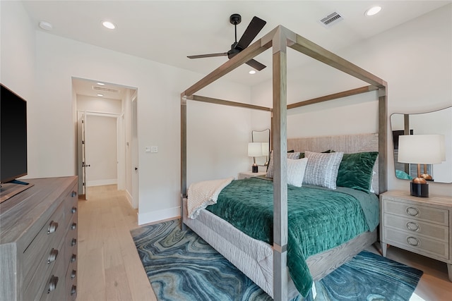 bedroom with ceiling fan and light hardwood / wood-style floors