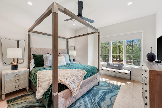 bedroom featuring light wood-type flooring and ceiling fan