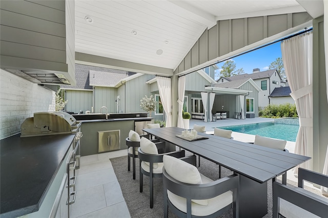 view of patio / terrace with a wet bar and exterior kitchen