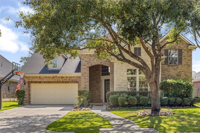 view of front of house featuring a front yard and a garage