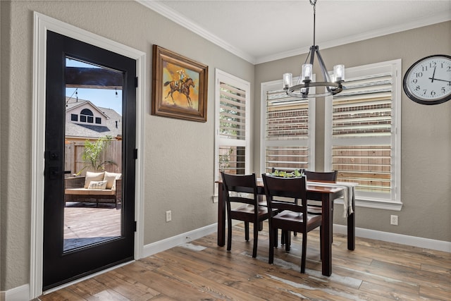 dining space featuring hardwood / wood-style flooring and a healthy amount of sunlight