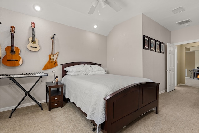 bedroom featuring lofted ceiling, light carpet, and ceiling fan