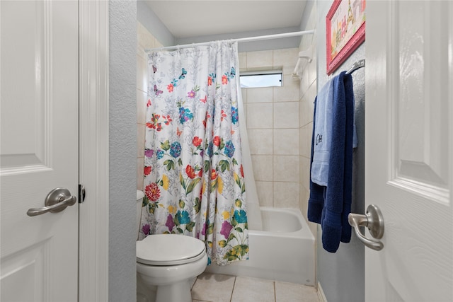 bathroom featuring shower / bath combination with curtain, tile patterned floors, and toilet